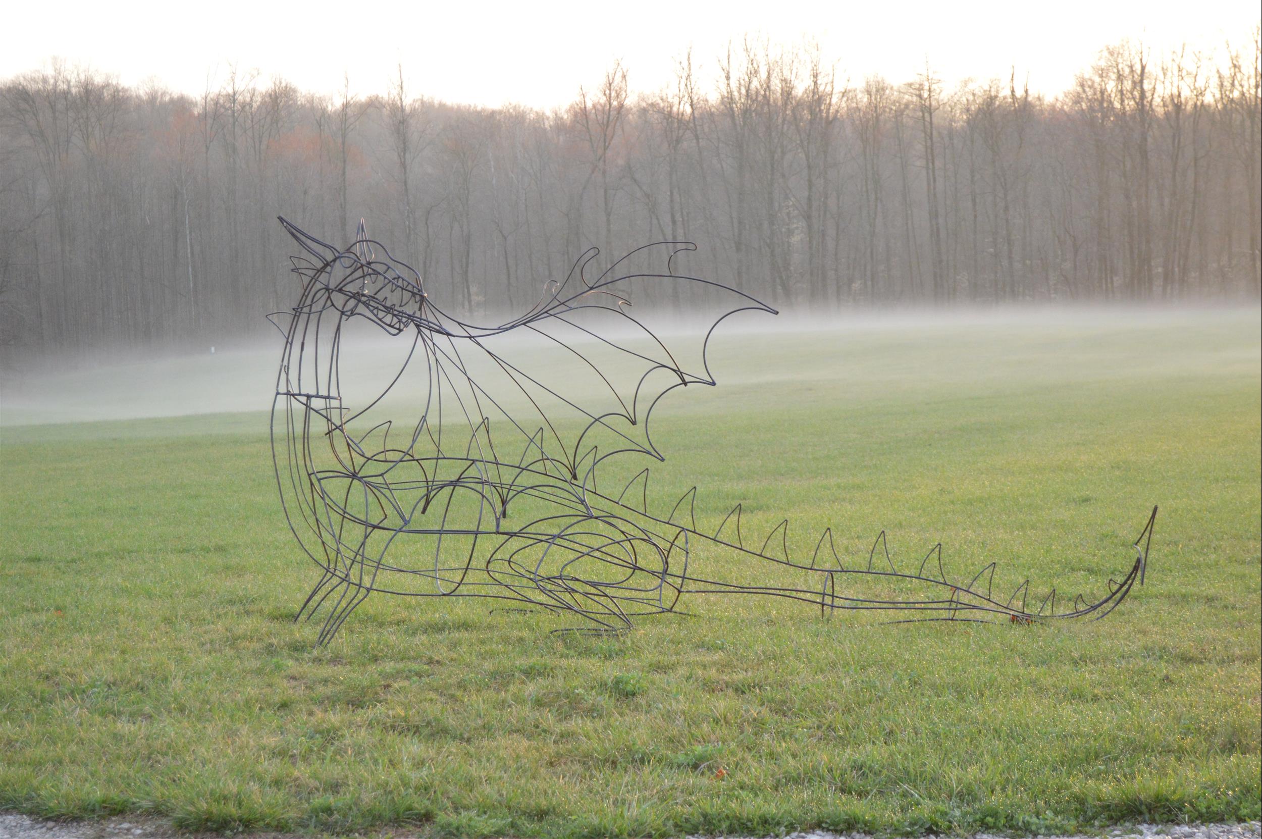 dragon wire sculpture in the fog